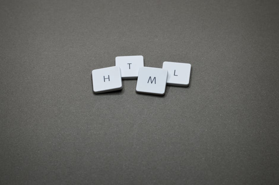 A close-up image features four white keyboard keycaps arranged in a horizontal line on a smooth, coral pink background. Each keycap displays a single black letter, spelling out 'H', 'T', 'M', and 'L' 
